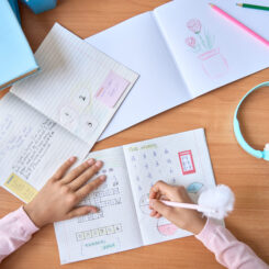 Table,Top,Closeup,View,Of,Kid,Student,Hands,Writing,Doing Table,Top,Closeup,View,Of,Kid,Student,Hands,Writing,Doing